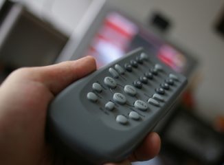 Remote control to watch television, including commercials by national advertisers